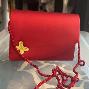 Elegant Red Satin Clutch with braided rope shoulder strap Butterfly Accent